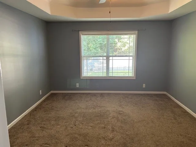 a view of a chandelier fan in a room