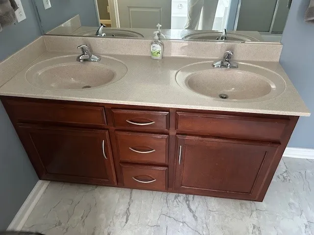 a bath tub sitting in a bathroom next to a window