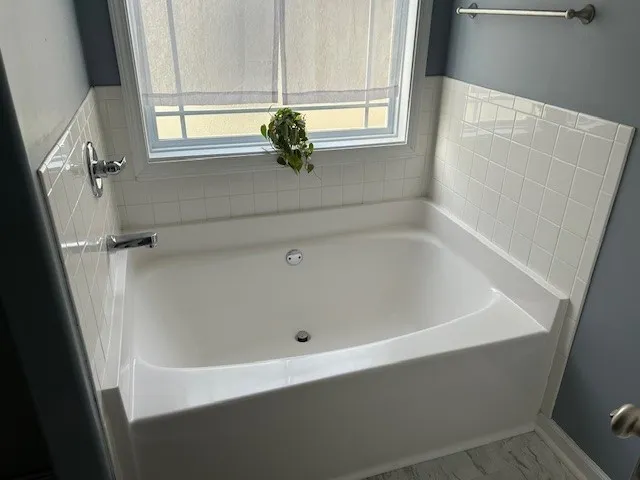 a bathroom with a glass shower door