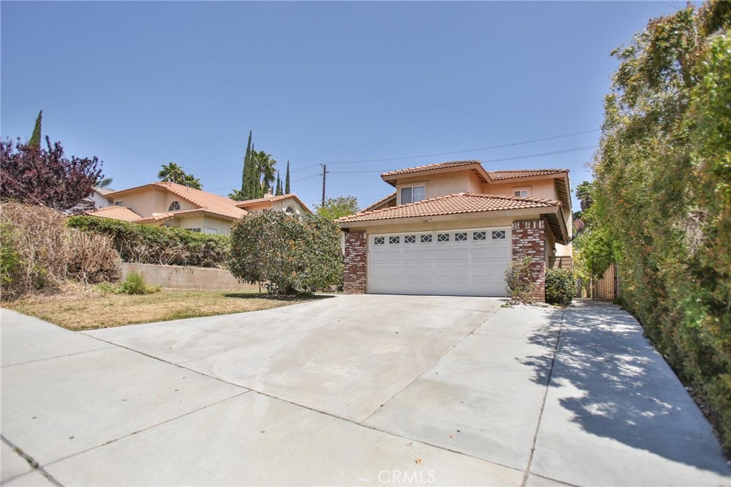 5100 Humboldt Court Riverside, CA 92507 - Photo 1 of 1 a front view of a house with a yard and garage