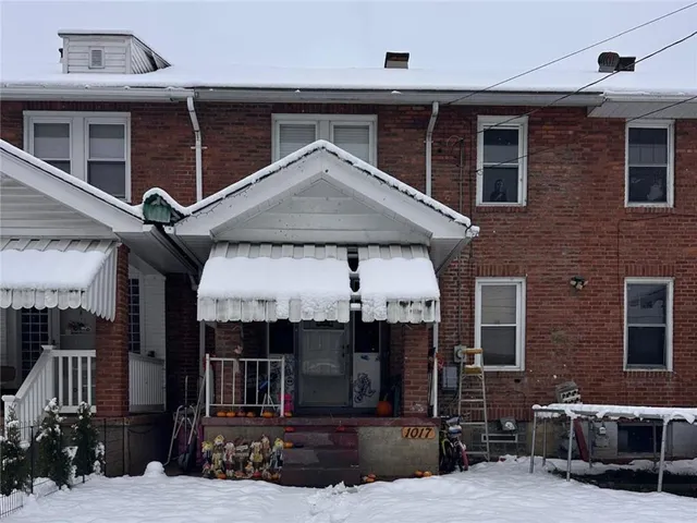 a front view of a house with garage