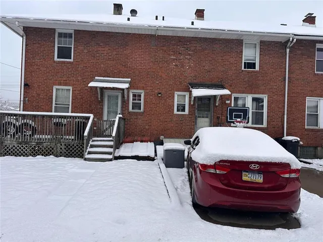 a view of a house with a barbeque