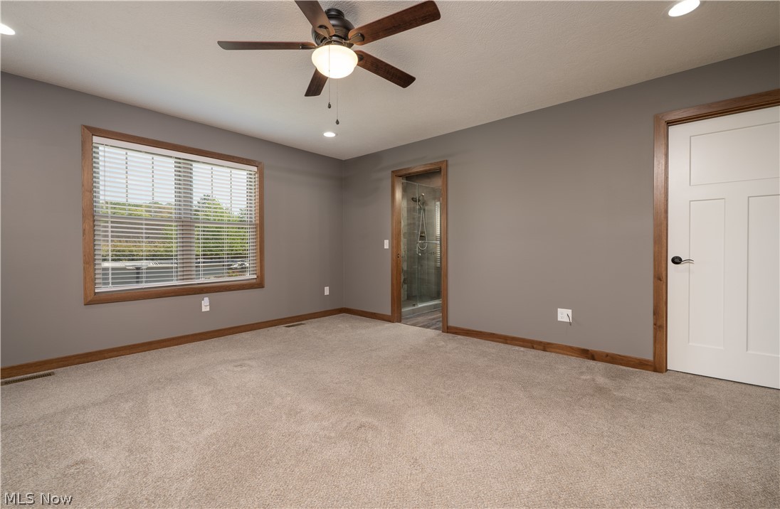3515 Eastport Road Southeast Dennison, OH 44621 - Photo 39 of 41 Spacious room featuring neutral carpeting and gray walls