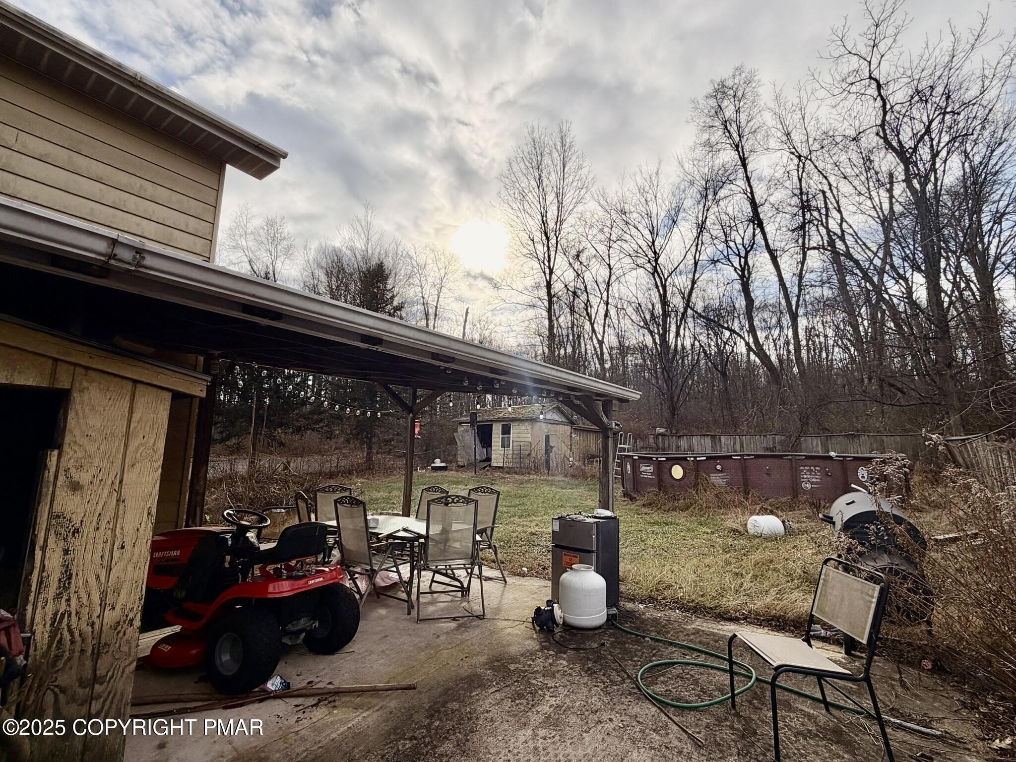 524 Independence Road East Stroudsburg, PA 18301 - Photo 17 of 17 a view of a patio with table and chairs potted plants and a barbeque