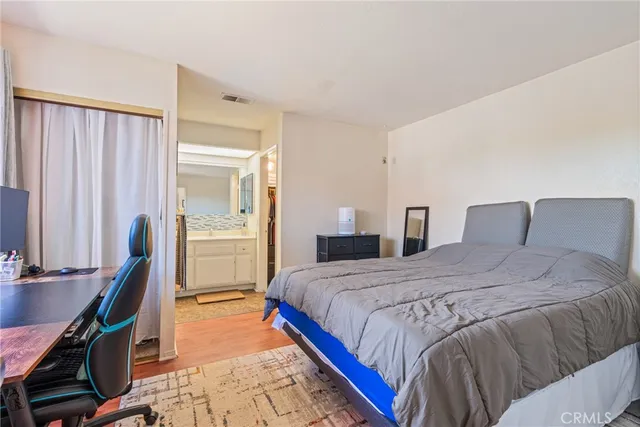 a bedroom with a bed and a table in it