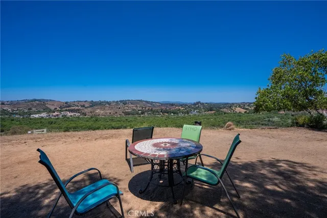 a view of a chairs and table in the patio