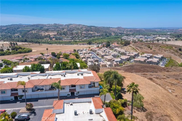 an aerial view of multiple house with pool