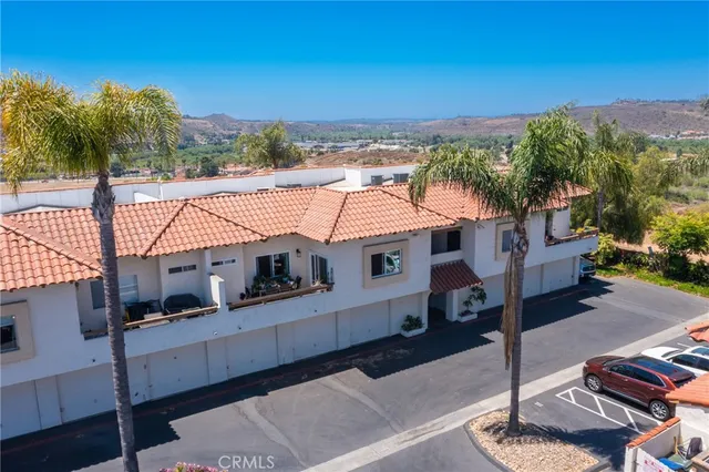 an aerial view of houses with outdoor space