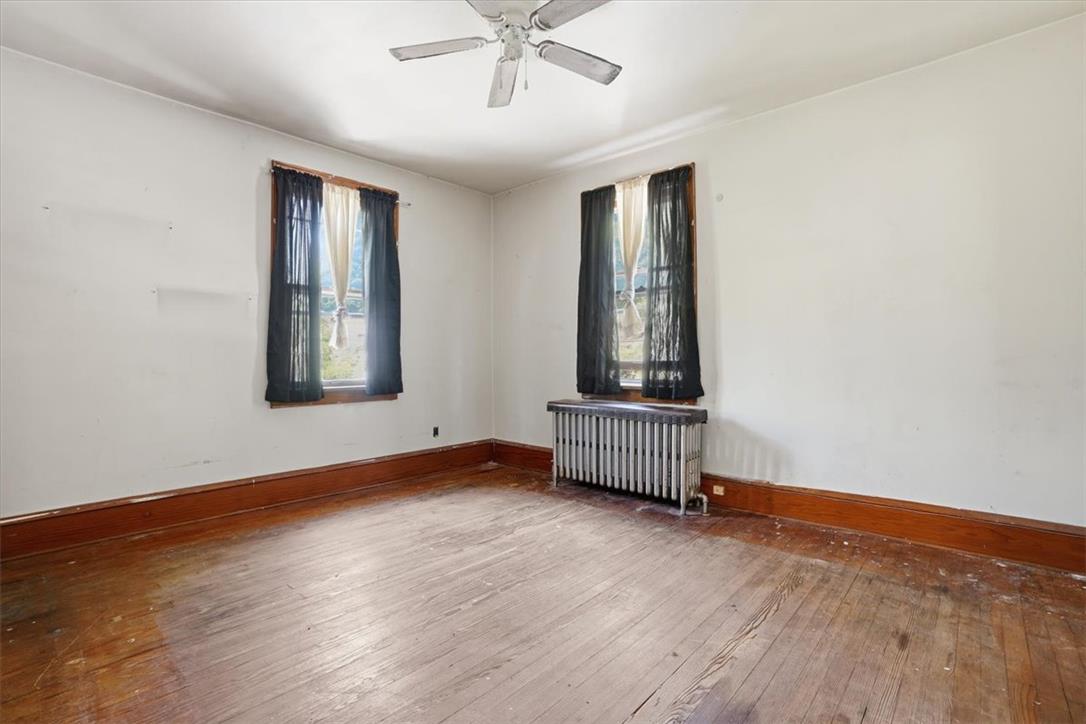 167 Main Road Lehighton, PA 18235 - Photo 31 of 41 Original wood flooring and ample natural light fill this inviting bedroom.