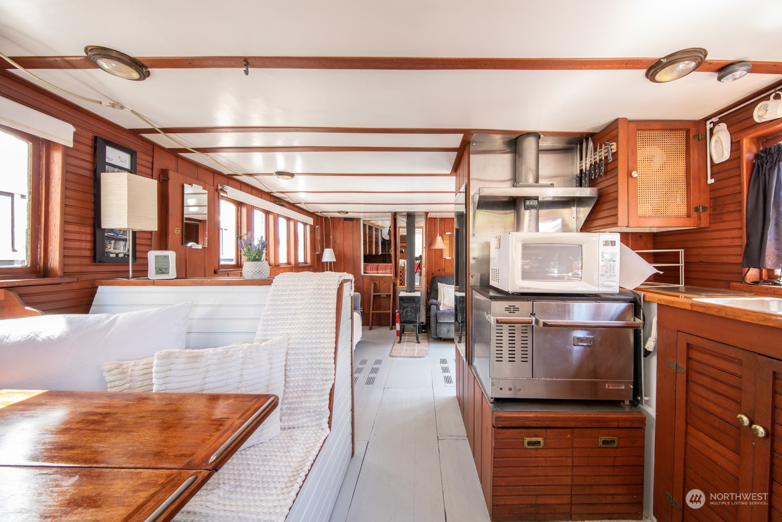 2143 North Northlake Way, Unit 34 Seattle, WA 98103 - Photo 11 of 26 a lobby with furniture and a flat screen tv