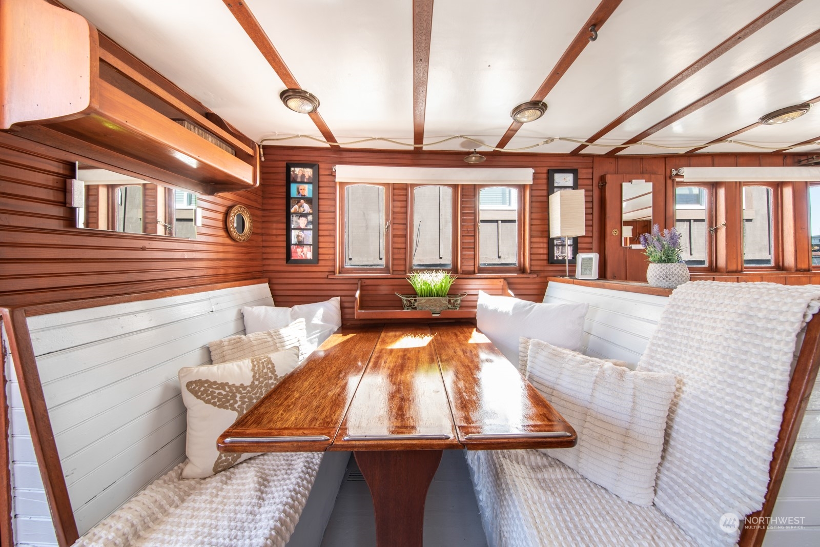 2143 North Northlake Way, Unit 34 Seattle, WA 98103 - Photo 12 of 26 a view of a dining room with furniture a chandelier and wooden floor