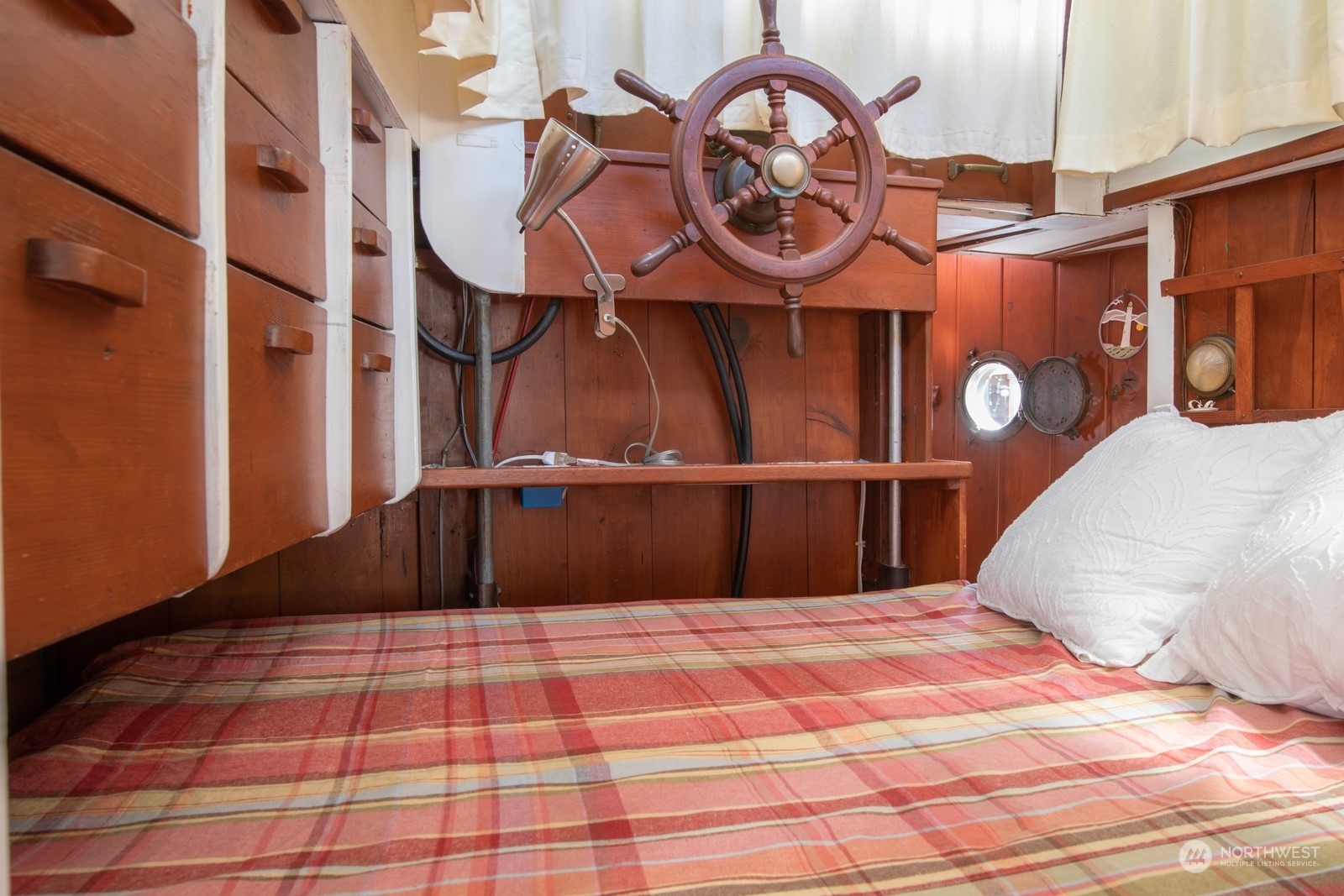 2143 North Northlake Way, Unit 34 Seattle, WA 98103 - Photo 14 of 26 a bedroom with a bed and a mirror