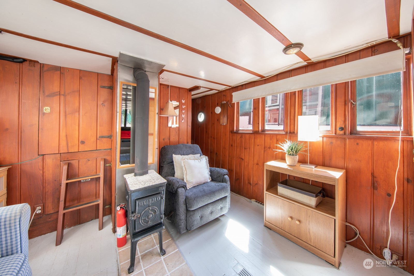 2143 North Northlake Way, Unit 34 Seattle, WA 98103 - Photo 4 of 26 a living room with furniture and a floor to ceiling window