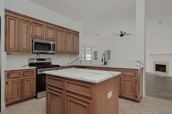 a kitchen with a stove and a microwave