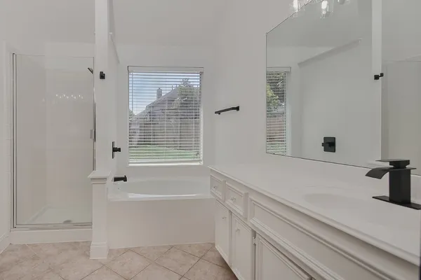 a bathroom with a bathtub and window