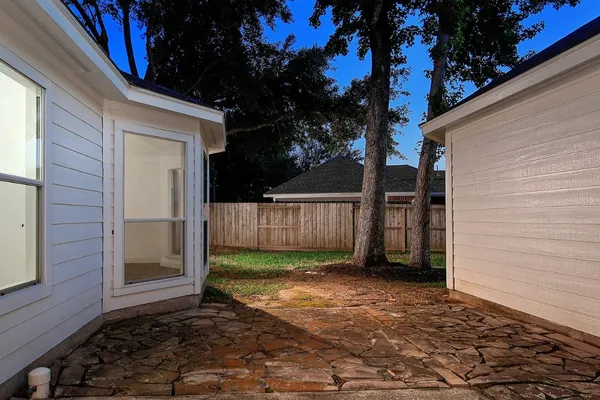 a view of a backyard of the house