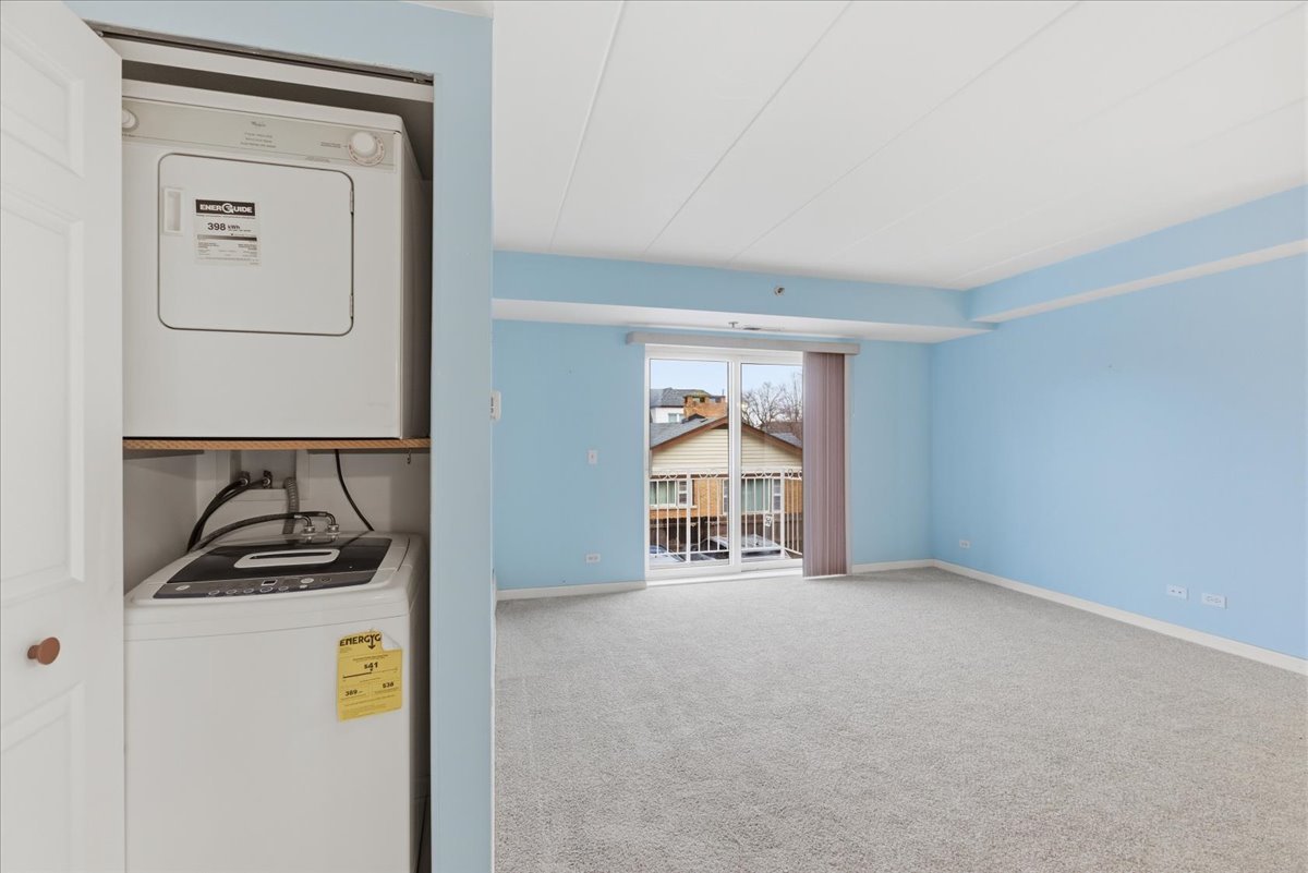 7316 40th Street, Unit 2E Lyons, IL 60534 - Photo 11 of 14 a room that has a bed and a window in it