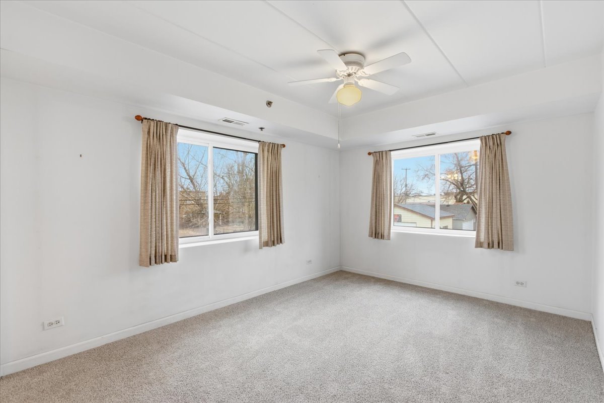 7316 40th Street, Unit 2E Lyons, IL 60534 - Photo 6 of 14 a view of an empty room with a window