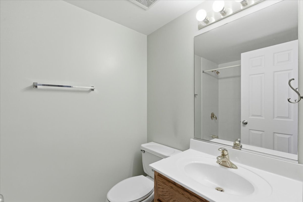 7316 40th Street, Unit 2E Lyons, IL 60534 - Photo 10 of 14 a bathroom with a sink toilet and shower