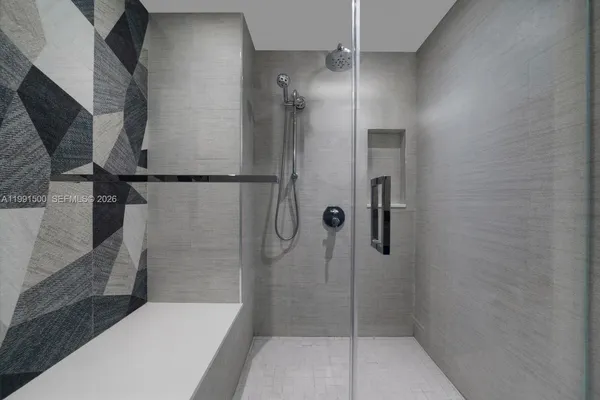 a bathroom with a shower and toilet