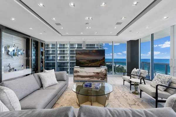 a living room with furniture and a flat screen tv