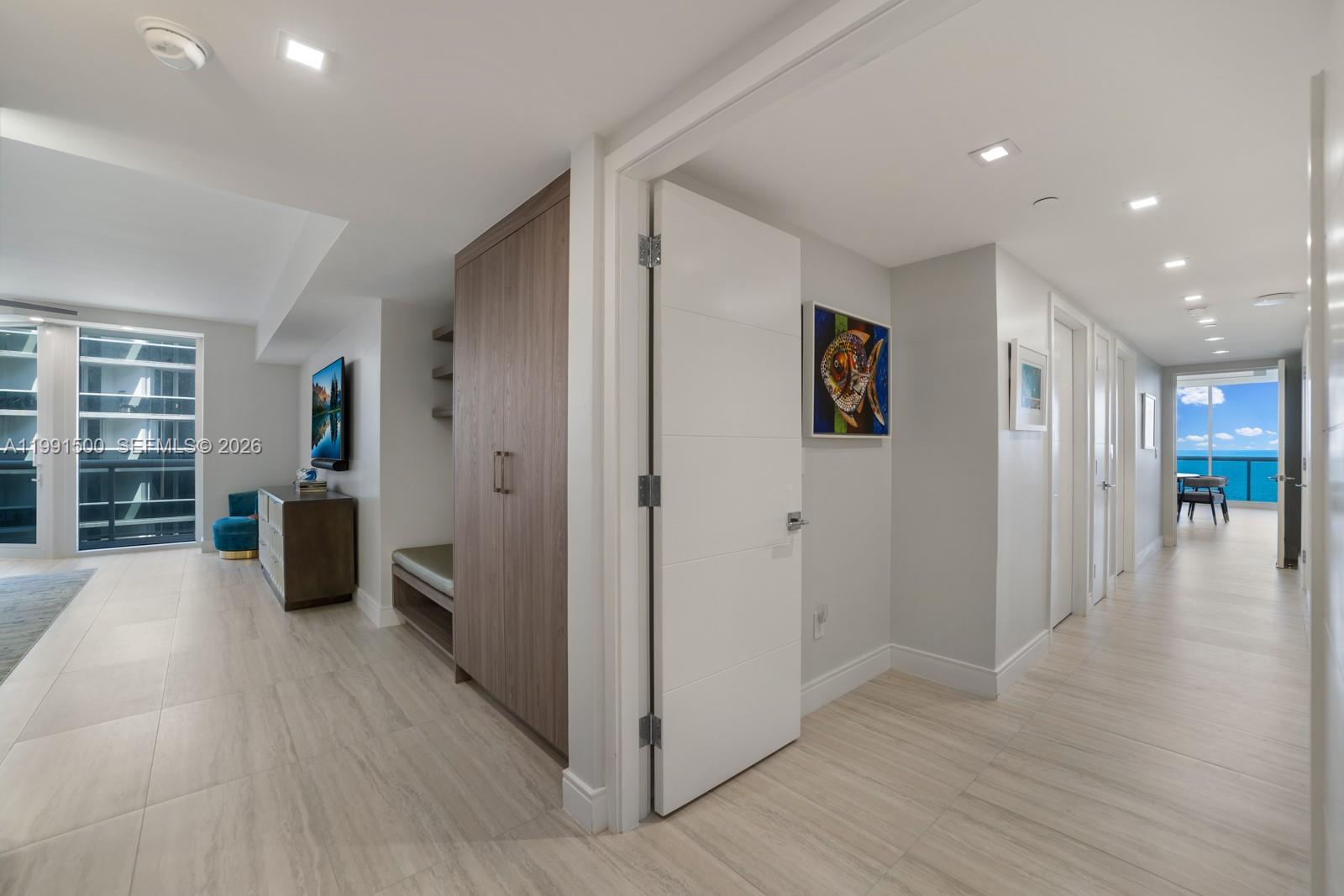 9559 Collins Avenue, Unit S8B Surfside, FL 33154 - Photo 22 of 42 a view of a living room with furniture and wooden floor
