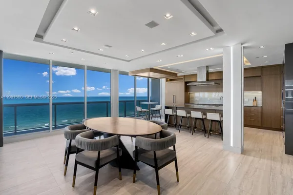 a dining room with furniture and window