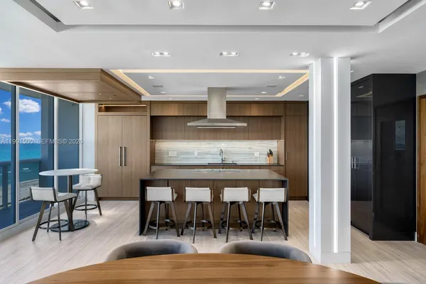 a view of dining room with furniture and wooden floor