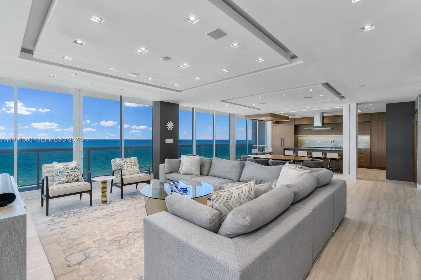 9559 Collins Avenue, Unit S8B Surfside, FL 33154 - Photo 3 of 42 a living room with furniture and a large window