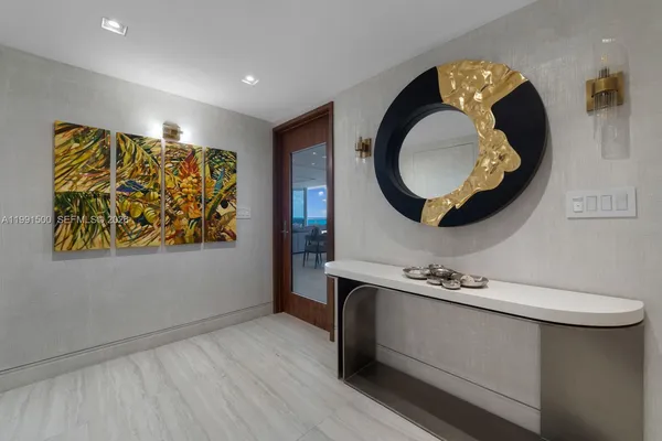 a bathroom with a sink mirror and vanity