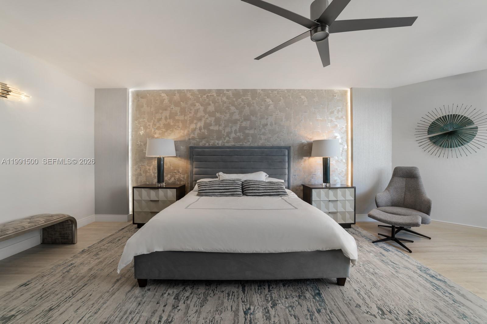 9559 Collins Avenue, Unit S8B Surfside, FL 33154 - Photo 7 of 42 a bedroom with a bed and a chandelier