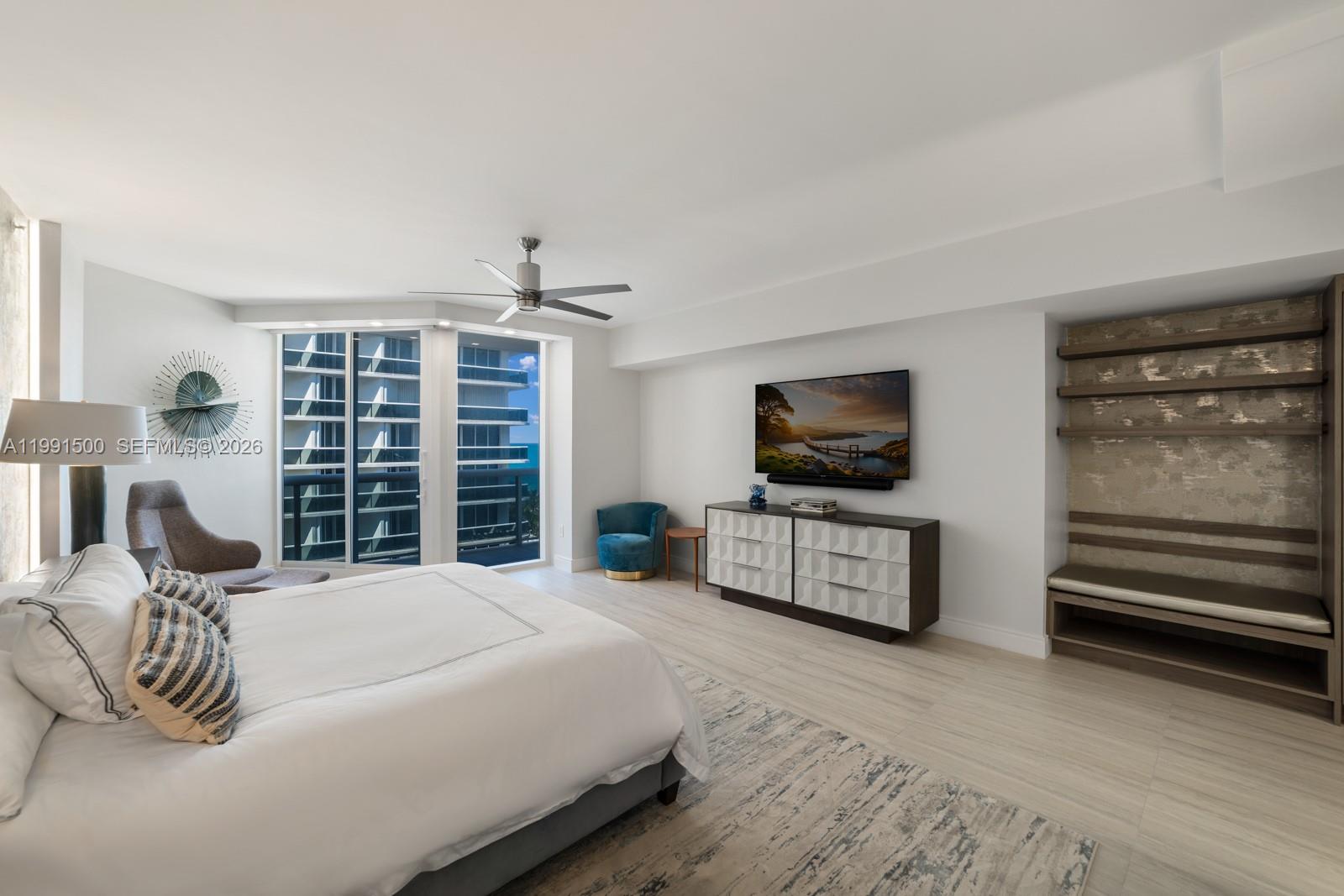 9559 Collins Avenue, Unit S8B Surfside, FL 33154 - Photo 8 of 42 a bedroom with a bed and flat screen tv