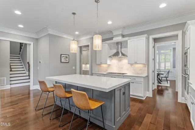 a kitchen with a table and chairs in it