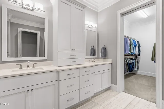 a bathroom with double sink and a mirror