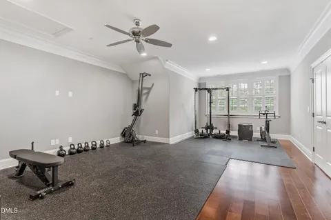 a view of a room with gym equipment and a large window