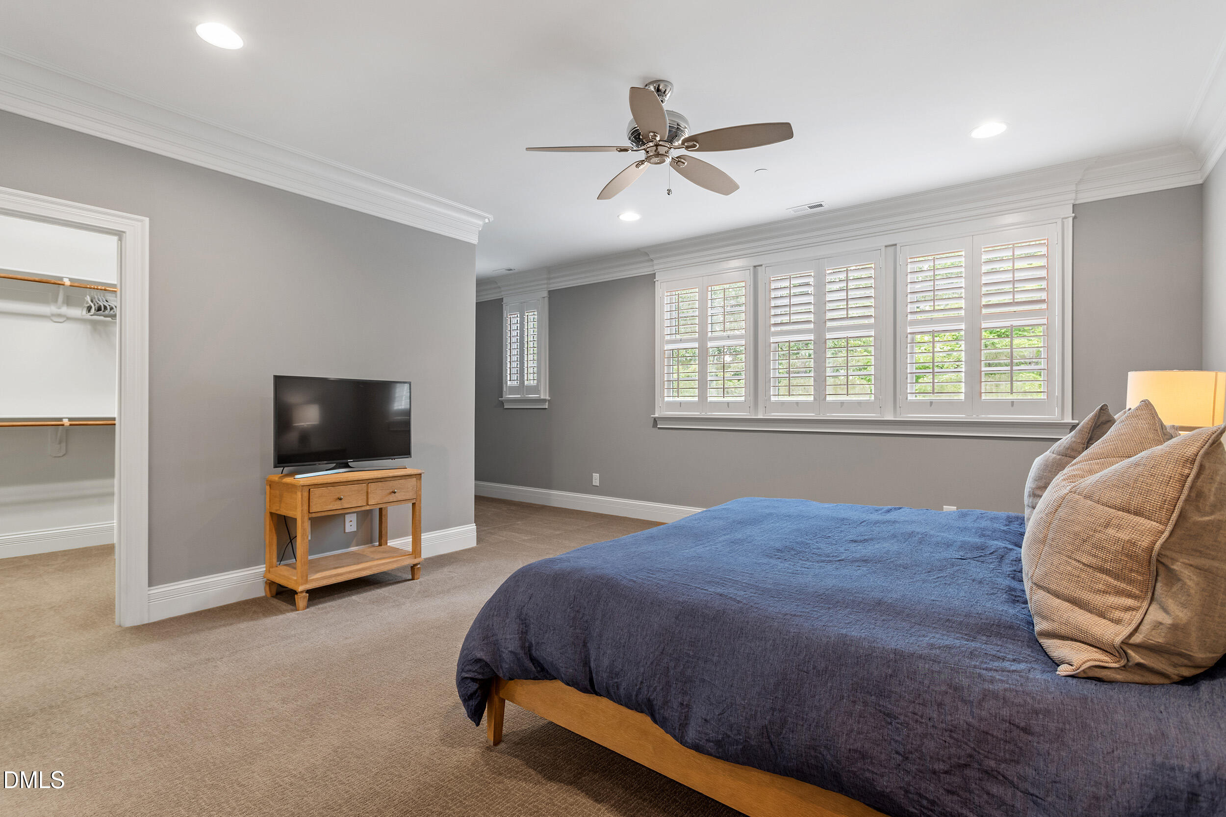 1361 Queensferry Road Cary, NC 27511 - Photo 35 of 50 a bedroom with a bed and a flat screen tv