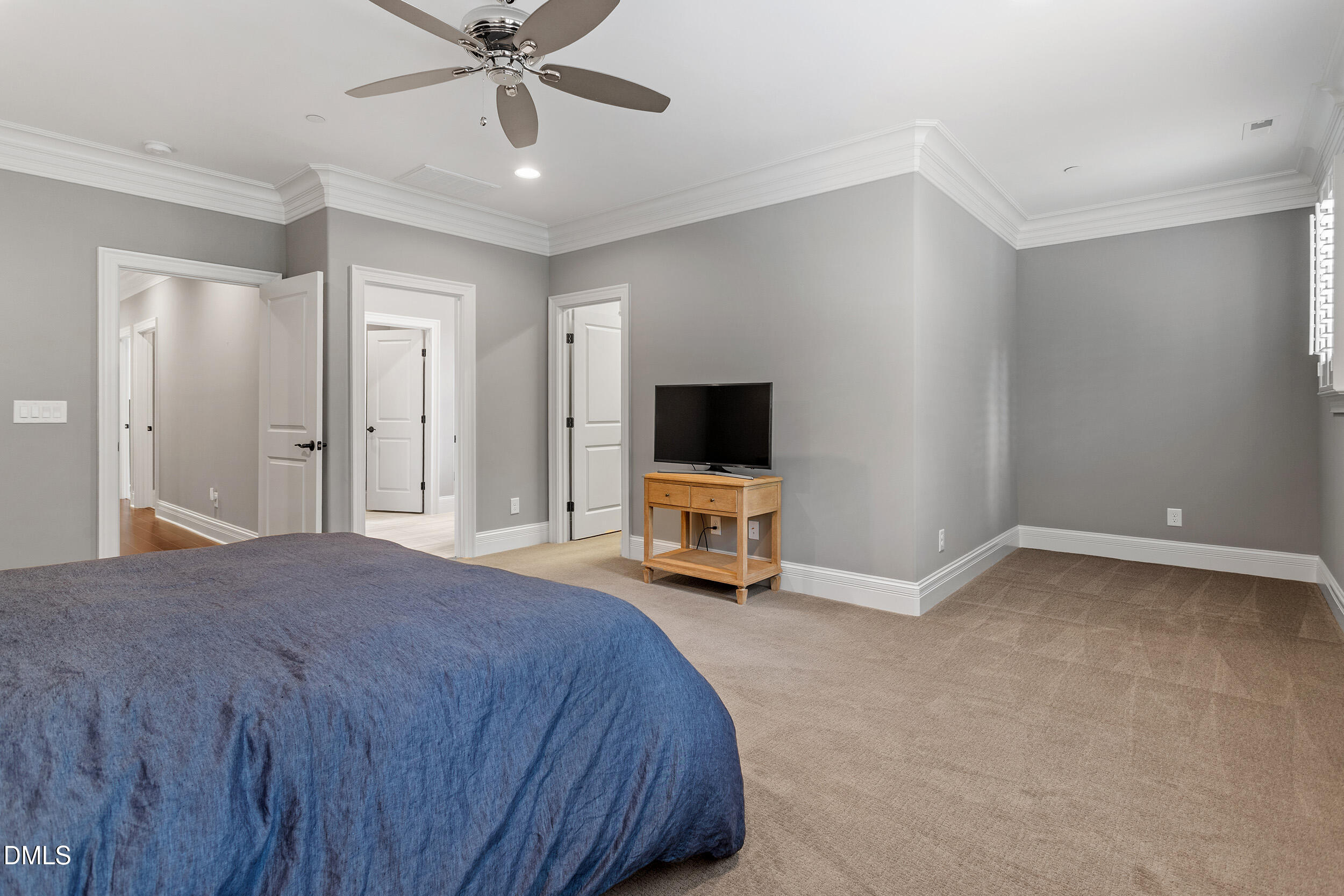 1361 Queensferry Road Cary, NC 27511 - Photo 36 of 50 a bedroom with a bed and a flat tv screen on dresser