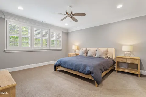 a spacious bedroom with a bed and window