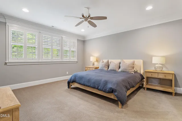 a spacious bedroom with a bed and window