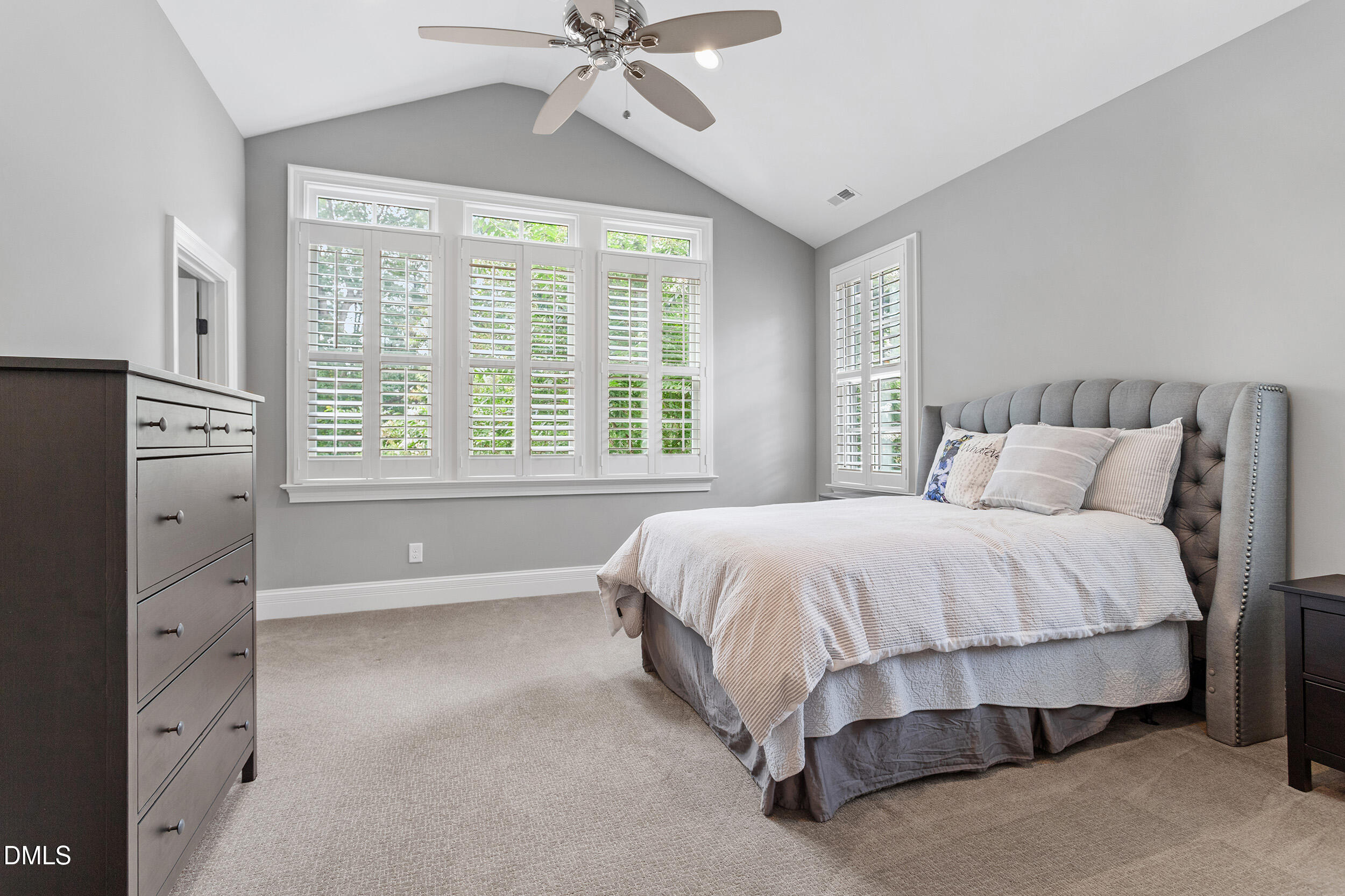 1361 Queensferry Road Cary, NC 27511 - Photo 41 of 50 a spacious bedroom with a bed and a chandelier