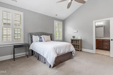 a spacious bedroom with a bed and a cabinets