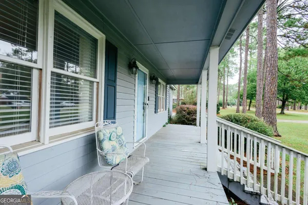 a view of balcony with furniture