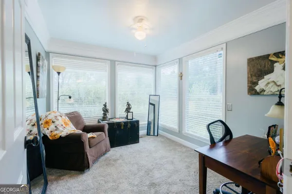 a living room with furniture and a window