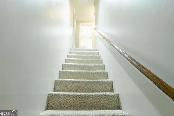 a bathroom with a sink a mirror and a shower curtain