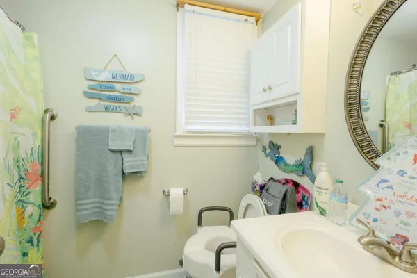 a bedroom with a bed and a television