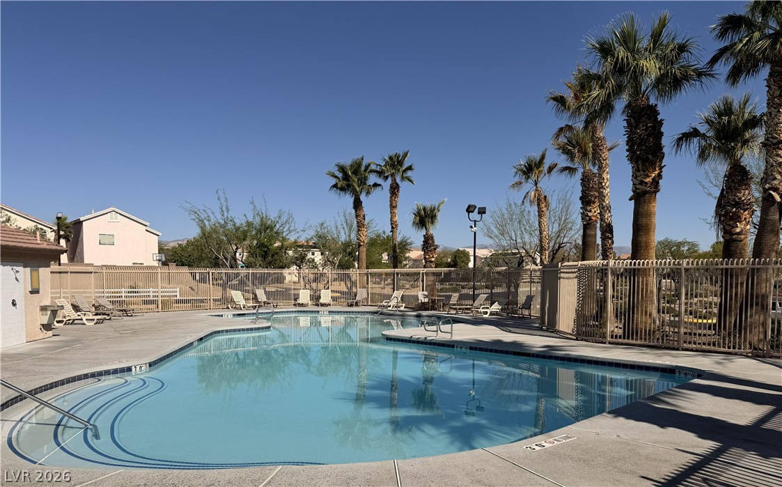 8909 Houston Ridge Avenue Las Vegas, NV 89178 - Photo 44 of 50 A desert oasis awaits with this community pool, perfect for sunny relaxation.