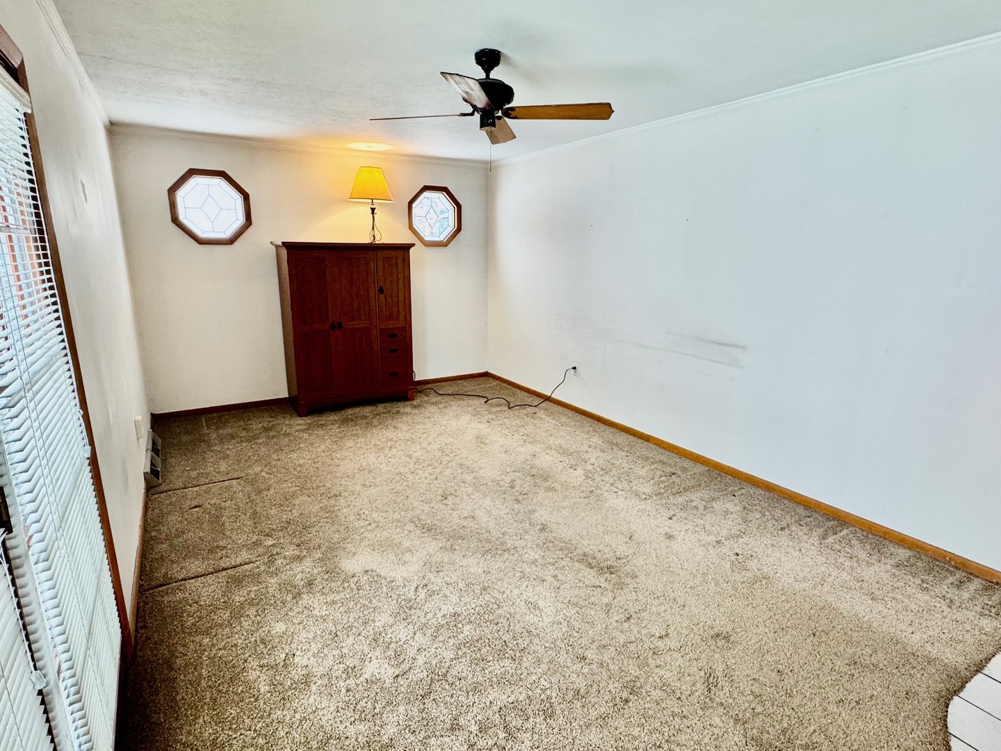 219 William Street New Lenox, IL 60451 - Photo 13 of 29 a view of a wall with a wall clock and a rug