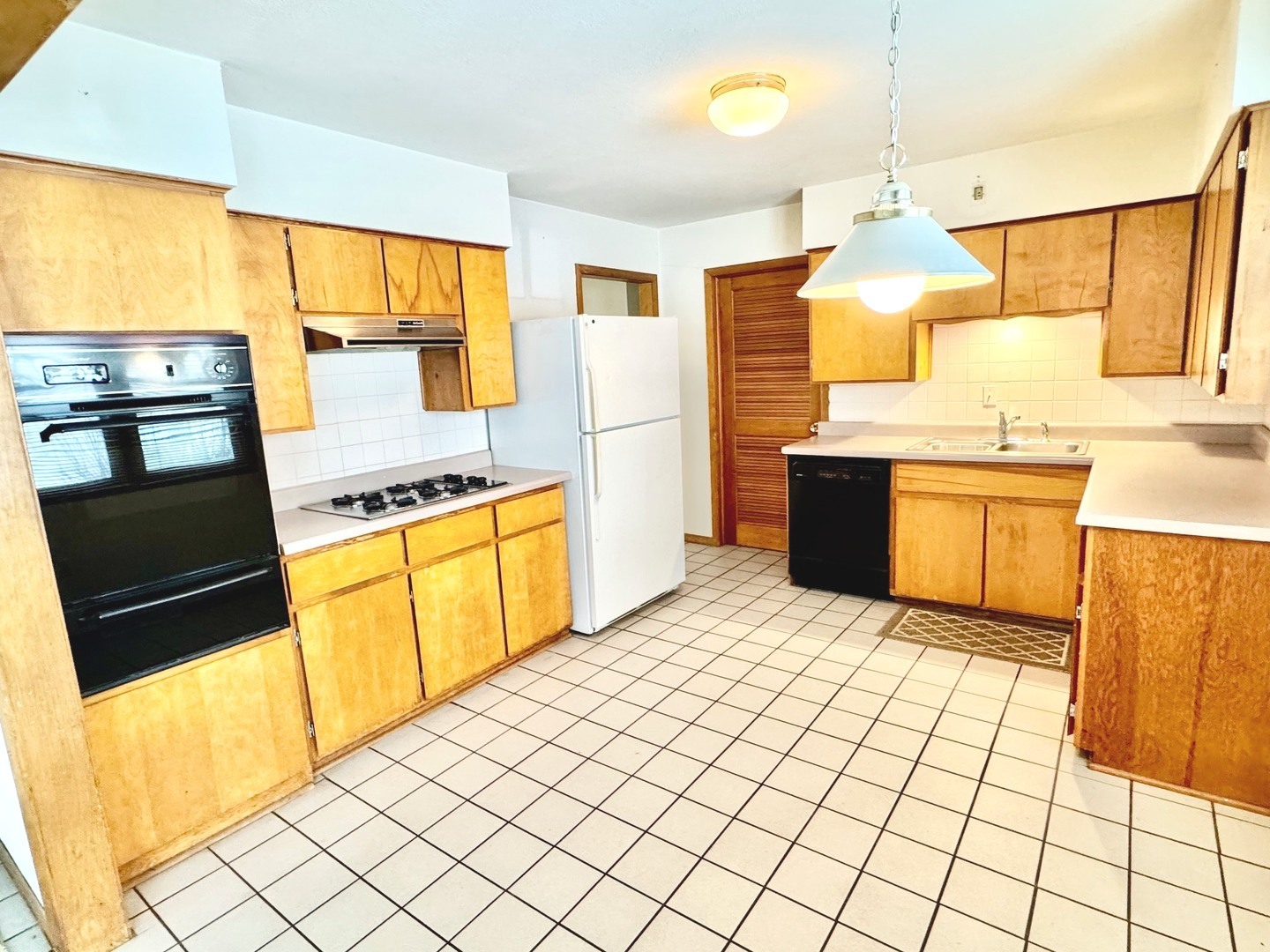 219 William Street New Lenox, IL 60451 - Photo 9 of 29 a kitchen with stainless steel appliances a stove a sink and a refrigerator