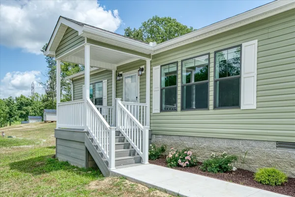front view of a house with a yard