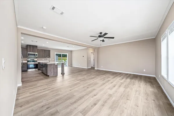 a view of kitchen and kitchen with sink